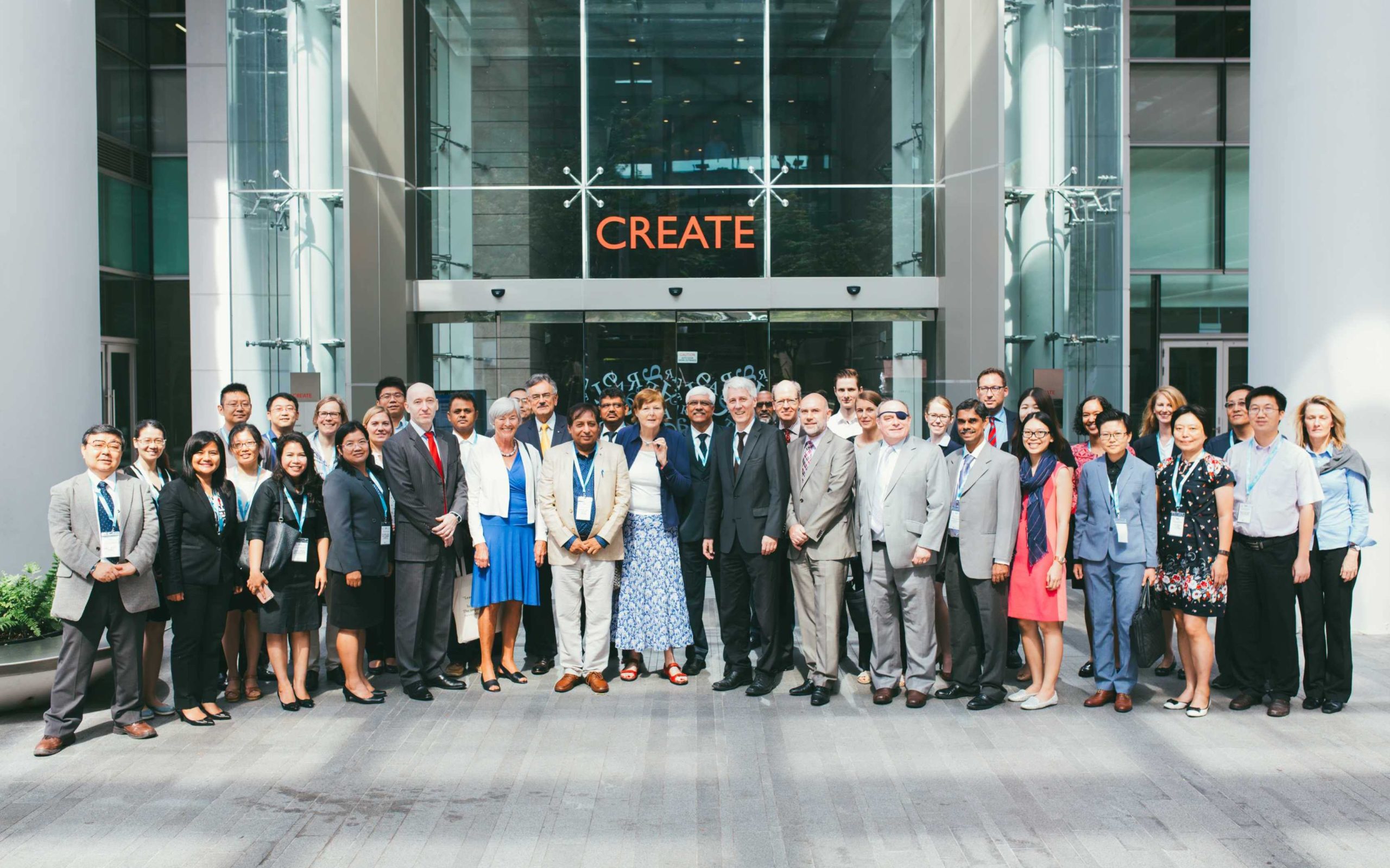 Group picture of the participants in front of the building of TUM Asia in Singapore
