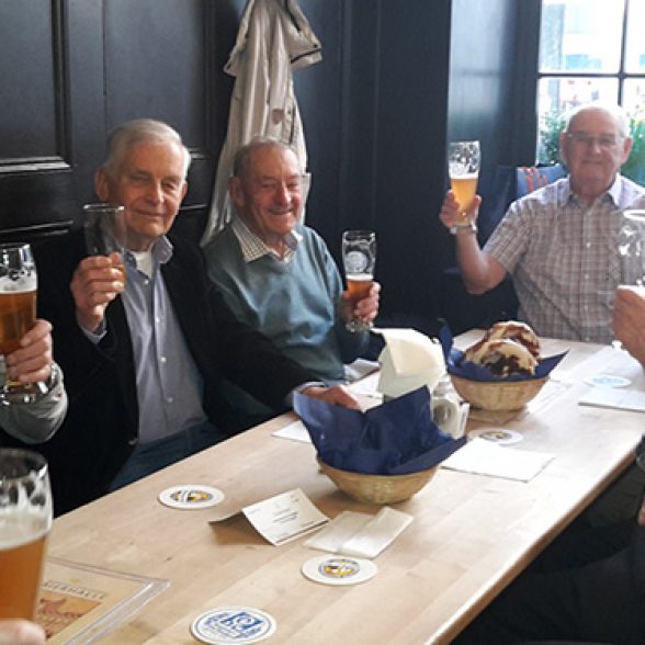 Civil engineers with beer at their alumni meeting