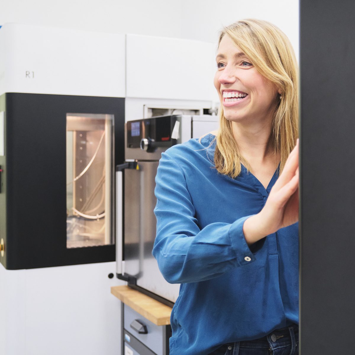 Miriam Haerst in front of the 3D printer she developed.