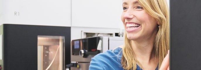 Miriam Haerst in front of the 3D printer she developed.